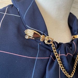 Vintage garment clips, excellent condition. Gold tone.